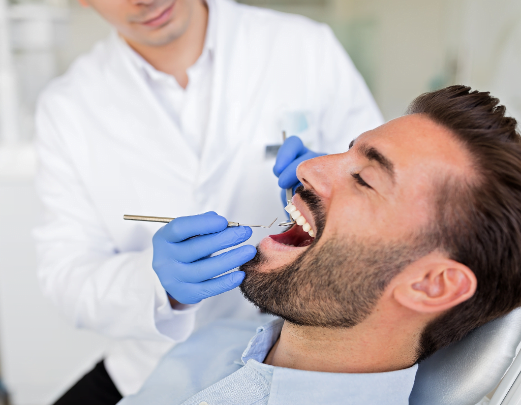a person getting his teeth checked