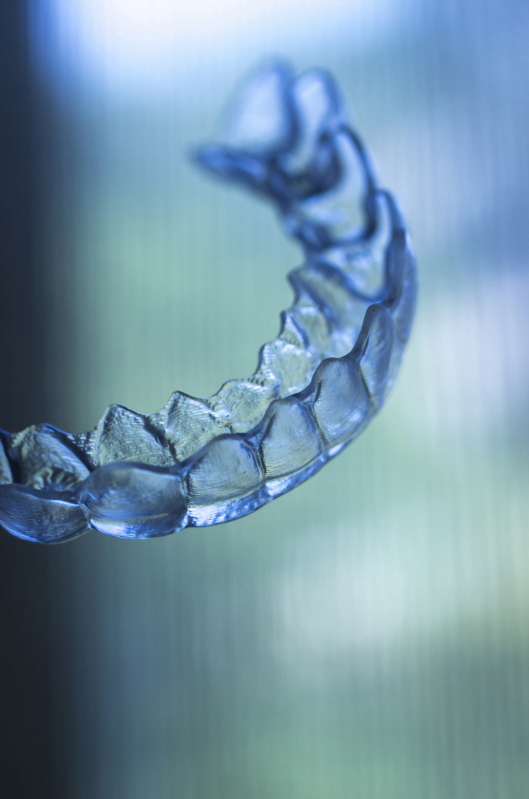a close-up of a clear dental aligner