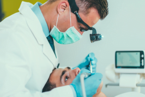 a dentist examining a person's teeth